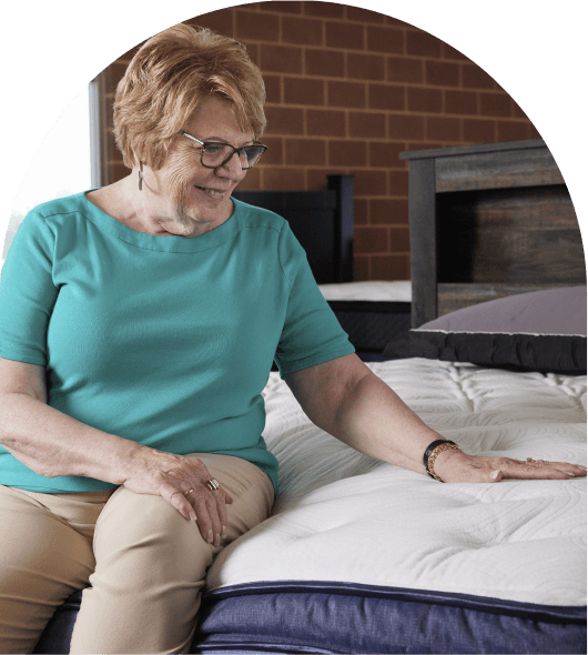 Woman shopping for a mattress